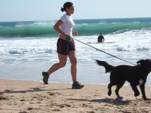Jogging_with_dog_at_Carcavelos_Beach